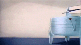 an animated gif of tom, the cat from tom and jerry, being rolled flat by a clothes wringer. he is holding a toaster which has also been wrung out and he folds up neatly on the floor