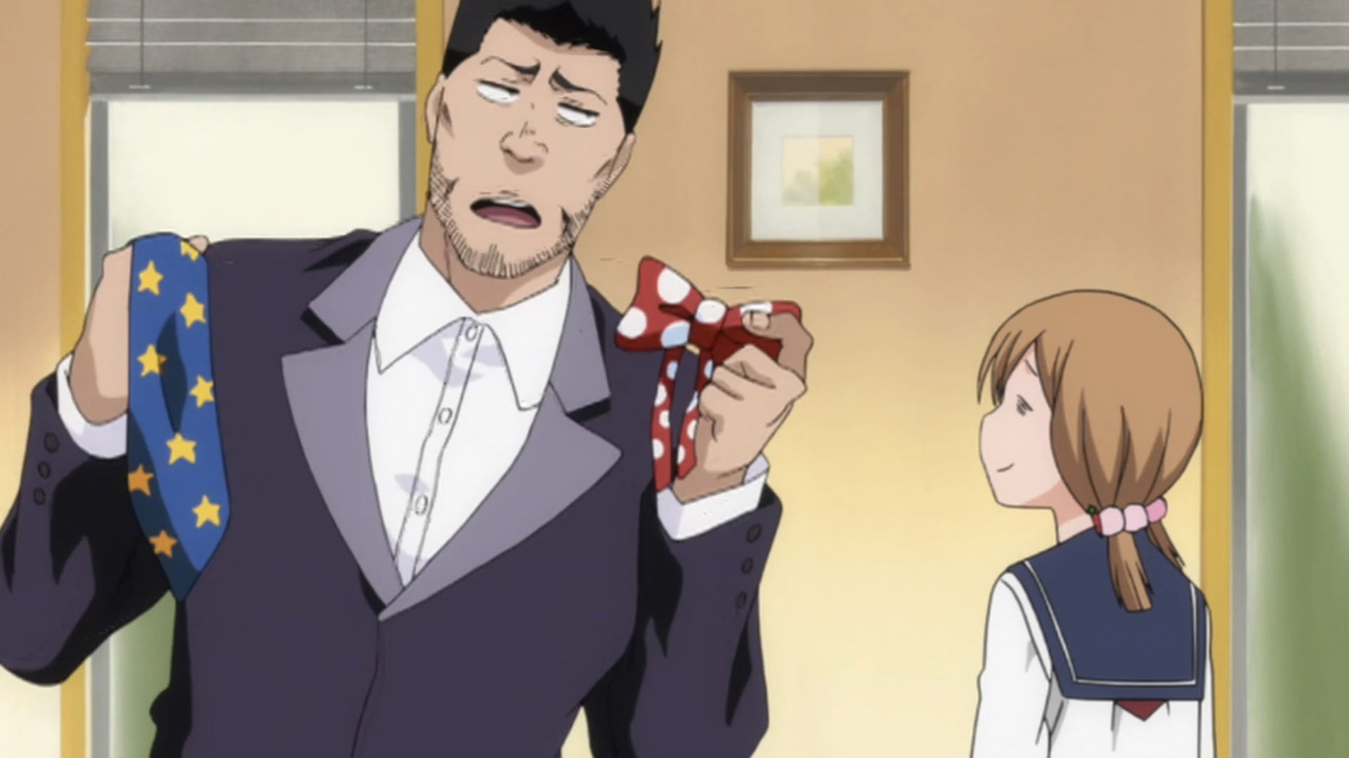 a screenshot from the Bleach anime. it features Isshin wearing a suit on the left and Yuzu on the right. Isshin holds up a blue tie and a red bowtie for Yuzu to choose for him, looking indecisive while Yuzu looks dazed